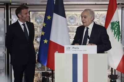 Lebanese Minister of Culture Ghassan Salame, right, and Macron at the exhibition. AFP