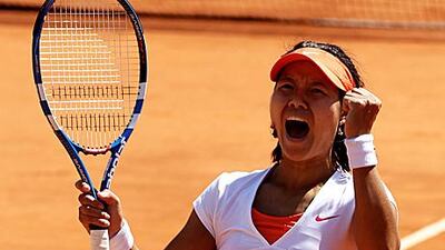 Li na roars in celebration at the French Open after reaching her second successive major final at the expense of Maria Sharapova.