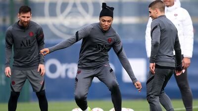 (From left) Lionel Messi, Kylian Mbappe and Marco Verratti take part during a training session at Paris Saint-Germain's Camp des Loges training ground on the eve of their Champions League Group A football match against RB Leipzig. AFP