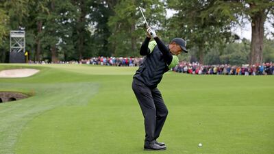 Tiger Woods plays a shot on the second fairway on the first day of the JP McManus Pro-Am. AFP