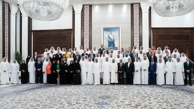 Sheikh Tahnoon bin Mohamed, Ruler's Representative in Al Ain Region (front row 10th right), Sheikh Mohamed bin Zayed, (front row 11th right) and Sheikh Mohammed bin Rashid (front row 12th right), stand for a photograph with Special Olympics sponsors, during an iftar reception at Al Bateen Palace. Eissa Al Hammadi for the Ministry of Presidential Affairs