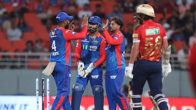 Delhi Capitals' wicketkeeper Rishabh Pant, and Kuldeep Yadav, right, celebrate the wicket of Punjab Kings' Jitesh Sharma. AP