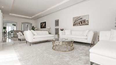 The 6-bedroom family home has porcelain tile flooring with a large open living area. Courtesy Luxhabitat