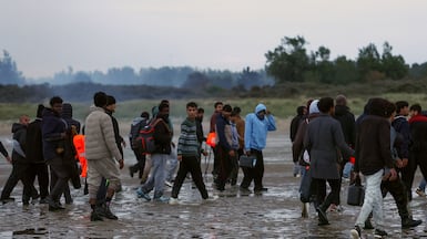 Migrants gather on the coast of northern France in an attempt to cross the English Channel to reach the UK. Reuters