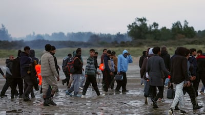 Migrants gather on the coast of northern France in an attempt to cross the English Channel to reach the UK. Reuters