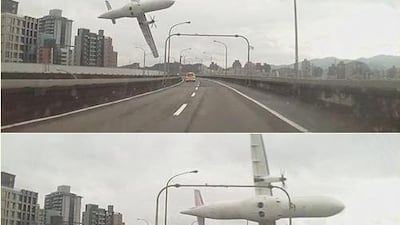 A still from a drivers' dash cam shows the Taiwan plane clip a motorway wall before crashing into the river. via Twiiter