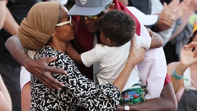 Barshim celebrates with his family after winning the final of the Men's High Jump. EPA