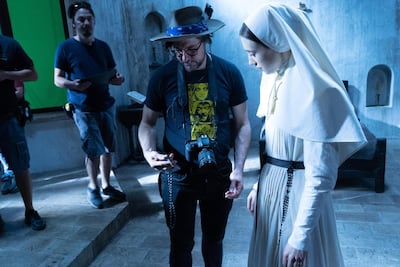 Corin Hardy directs Taissa Farmiga, who plays Sister Irene, on the set of ‘The Nun’, the fifth film in ‘The Conjuring’ franchise. Courtesy Warner Bros. Pictures