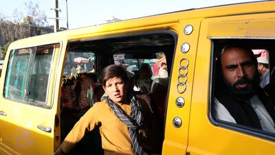 An Afghan child looks from inside a van in Kabul, Afghanistan. Reuters