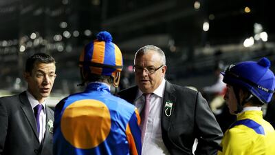 Mike de Kock, centre, trains Journeyman, who will race in the 1,400 metres handicap at Meydan Racecourse on Wednesday night. Francois Nel / Getty Images.