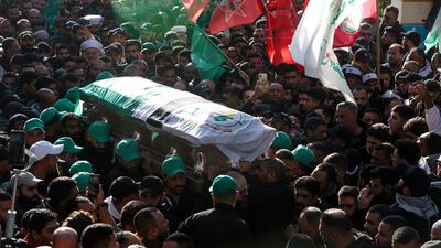 People pay their respects to one of those killed alongside Hamas's deputy leader by an Israeli strike in southern Beirut. Reuters