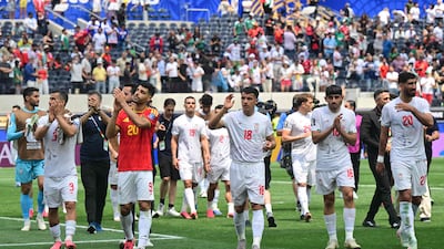 Iran's players salute the fans at the end of the 2026 World Cup Group G match against Belgium. AFP