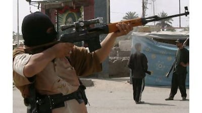 The Mahdi Army disbanded in 2008 with the Sadrists insisting they were leaving violent opposition to US forces. Above, militiamen patrol a street in Basra.