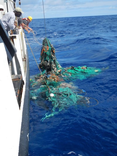 The crew of the RV Ocean Starr pull a net filled with plastic from the Pacific Ocean in 2015. Courtesy: Ocean Cleanup