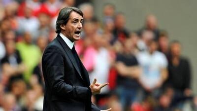 Manchester City's manager Roberto Mancini reacts during their FA Cup semi-final soccer match against Manchester United at Wembley Stadium in London, April 16, 2011. REUTERS/Toby Melville (BRITAIN - Tags: SPORT SOCCER) Picture Supplied by Action Images *** Local Caption *** 2011-04-16T163921Z_1888388388_GM1E74H01XG01_RTRMADP_3_SOCCER-ENGLAND-CUP.JPG