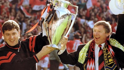 1994 - Manchester United win the 'Double', the Premier League and FA Cup. Alex Ferguson is seen here with Brian Kidd celebrating their Premier League title win. Bob Collier / Reuters