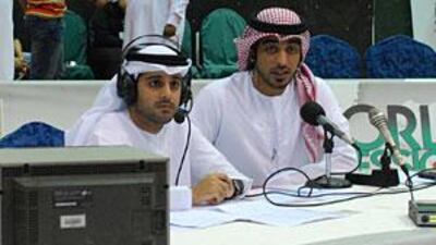 Mohammed Jassim al Housani, left, a 25-year-old Emirati from Abu Dhabi, who has been hired by the Ultimate Fighting Championship to be its first ever Arabic commentator and analyst, with Osama Al Amiri, a commentator on Abu Dhabi Sports TV.