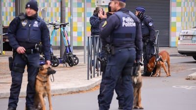 Belgian police officers secure the area where gunman Abdesalam Lassoued was shot dead in Brussels. EPA
