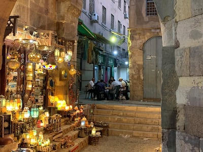 Shopkeepers eating iftar at Cairo's historic Khan El Khalili bazaar. Hamza Hendawi / The National