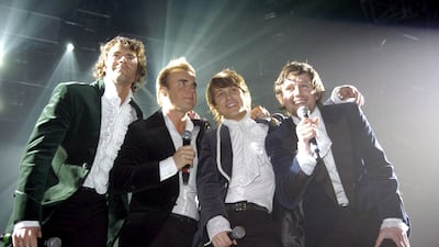 The members of former boy band Take That, left to right, Howard Donald, Gary Barlow, Mark Owen and Jason Orange, back on stage for the first time in 10 years at the Metro Radio Arena (now Utilita Arena Newcastle) in Newcastle upon Tyne, northern England on April 23, 2006.