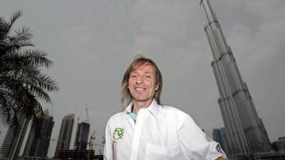 French climber Alain Robert, also known known as the French Spiderman, in front of Burj Khalifa, which he plans to climb.
