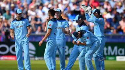 England fast bowler Mark Wood celebrates with his teammates after the dismissal of New Zealand captain Kane Williamson on Wednesday. Clive Mason / Getty Images