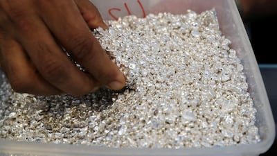 Raw silver is stored in containers before being melted down and used to make jewellery at Sharjah's Al Baroon Gold Factory. Pawan Singh / The National