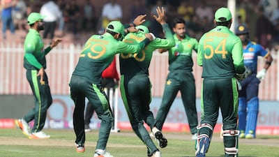 Pakistan's cricketers celebrate the dismissal of Sri Lanka batsman Lahiru Thirimanne. Karim Sahib / AFP