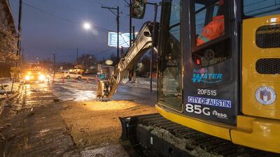 A council worker uses a bulldozer to restore water supply in Austin. Texas is the largest contributor to the US power grid. Bloomberg