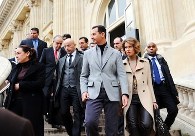 Syria's ousted president Bashar Al Assad, his wife Asma, right, and French Culture Minister Frederic Mitterrand leave the Grand Palais after their visit to an exhibition in Paris in 2011. AFP