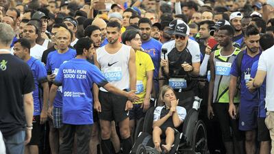 People participate in the Dubai Run on Sheikh Zayed Road. Satish Kumar / The National