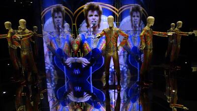 The Ziggy Stardust jumpsuit designed by Freddie Burretti (1972) is reflected in mirrors of an installation at the David Bowie exhibition at the Martin-Gropius-Bau museum in Berlin, seen during a preview on May 19, 2014. The retrospective that was on display at London’s Victoria and Albert Museum before will be running in the German capital from May 20 to August 10, 2014. Johannes Eisele / AFP photo