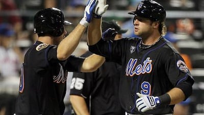 New York Mets' Kirk Nieuwenhuis and Josh Thole celebrate