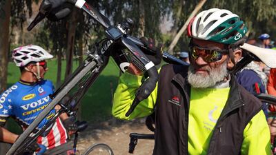 Men cycle during the contest for Peace Cup on the first day of reduction in violence between Afghan Government and Taliban. EPA