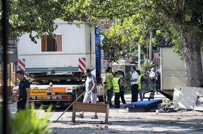 Mandatory Credit: Photo by MASSIMO PERCOSSI/EPA-EFE/Shutterstock (9771930h) The removal of the last housing modules is underway inside the Camping River Roma camp in Rome, Italy, 27 July 2018. Rome Mayor Virginia Raggi on 26 July hailed the clearance and closure of the Camping River Roma camp in the Italian capital. The European Court of Human Rights (ECHR) had called for the clearance of the site to be suspended after an appeal by three inhabitants. The Rome city council informed the court about the issue and said that the clearance was necessary due to public health risks. Clearing of gypsy camp in Rome, Italy - 27 Jul 2018