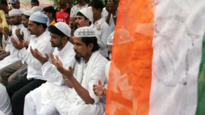 Supporters of India's ruling Congress Party pray for the government's victory during an all faith prayer meeting organized in Allahabad.