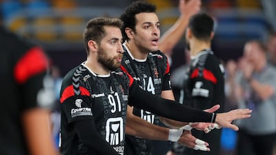 Egypt's right winger Mohammad Sanad, left, and pivot Ibrahim El Masry against Denmark. AFP