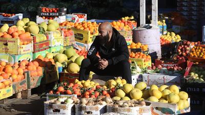 A Palestinian farmer waits to sell his fruit at the Nablus Wholesale Market in Nablus, West Bank. EPA