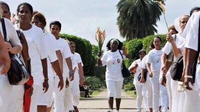 Berta Soler, the Ladies in White opposition movement leader, centre, was briefly detained with 50 other members by Cuban authorities.