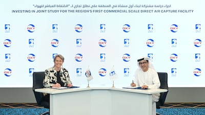 Vicki Hollub, president and chief executive of Occidental, and Musabbeh Al Kaabi, executive director for low carbon solutions and international growth at Adnoc, signing the deal. Photo: Adnoc