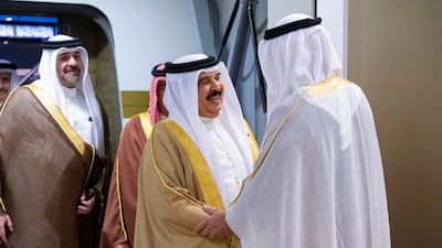 Sheikh Mohamed and King Hamad greet each other at the airport. Mohamed Al Hammadi / UAE Presidential Court