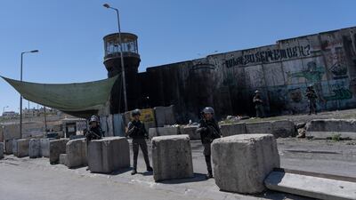 Israeli Border Police secure the perimeter of the closed Israeli army Qalandia checkpoint, used by Palestinians to cross from the West Bank into Jerusalem, near the West Bank city of Ramallah. AP Photo