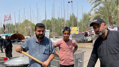 Ali Al Safi (left), 35, travelled from the southern province of Thi Qar to serve the protesters with food. All photos: Sinan Mahmoud/The National