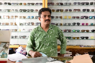 Presod Unnithean, a technician and salesman at Eye Care Centre, said flooding damaged thousands of dirhams worth of stock at the shop in Fujairah. Khushnum Bhandari / The National