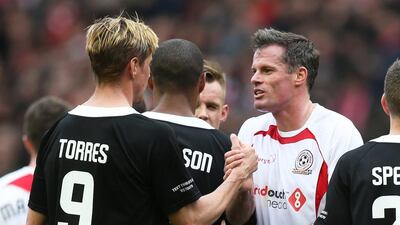 Jamie Carragher and Fernando Torres at the end of the match. Alex Morton / Reuters