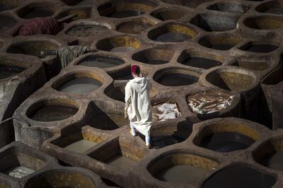 A Moroccan man walks in the tannery in the 9th century walled medina in the ancient city of Fez. AFP