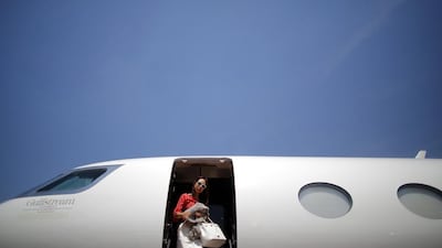 A guest descends from a Gulfstream G650 aircraft at the Shanghai International Business Aviation Show. The price of business jets is plummeting. Carlos Barria / Reuters