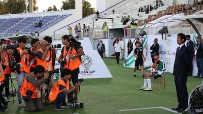 Japan's head coach Hajime Moriyasu, right, reacts. EPA