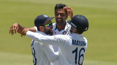 India captain Virat Kohli, left, celebrates with Mayank Agarwal and Ravi Ashwin after winning the first Test at SuperSport Park in Centurion. AFP