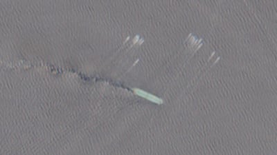 A satellite image shows a group of small boats near the Strait of Hormuz. The US accused Iran of attacking three commercial vessels in the waterway. Reuters